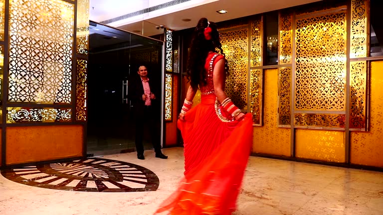 Slow motion of dancing Indian Bride in front of her husband in reception party hall