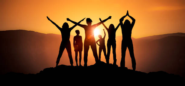 istock Several female silhouettes at sunrise 1223791819