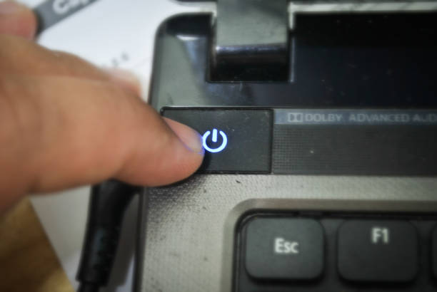 istock Finger press the Power swicth button on laptop 1223792627