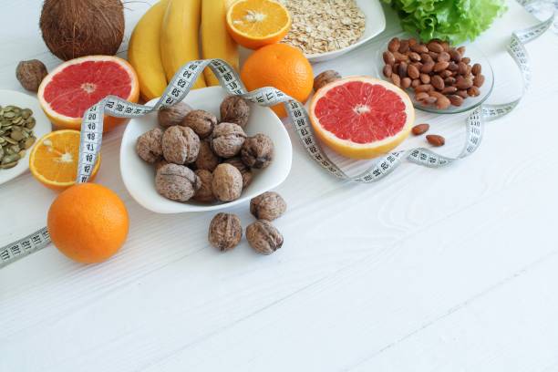 istock Colorful set of diet products, fruit and nuts closeup with copy space 1223793373