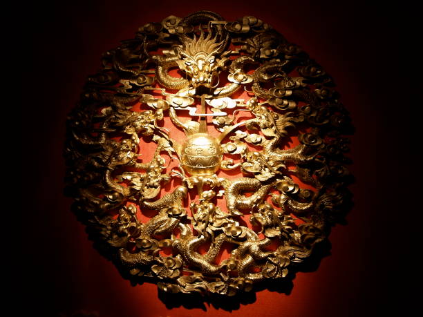 istock Golden Wall Ornament with Dramatic Lighting 1223796903