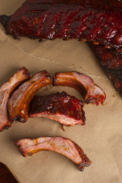 istock Barbecue. Picnic BBQ table spread. Beef brisket, chicken, pork ribs, beef ribs, Mac n cheese, cornbread, Brussels sprouts, coleslaw, and beer. Classic traditional Texas bbq meats and side dishes. 1223797845