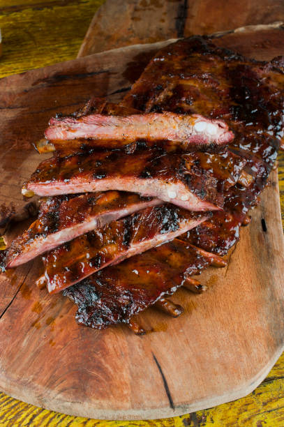 istock Barbecue. Picnic BBQ table spread. Beef brisket, chicken, pork ribs, beef ribs, Mac n cheese, cornbread, Brussels sprouts, coleslaw, and beer. Classic traditional Texas bbq meats and side dishes. 1223797849