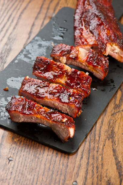 istock Barbecue. Picnic BBQ table spread. Beef brisket, chicken, pork ribs, beef ribs, Mac n cheese, cornbread, Brussels sprouts, coleslaw, and beer. Classic traditional Texas bbq meats and side dishes. 1223797886