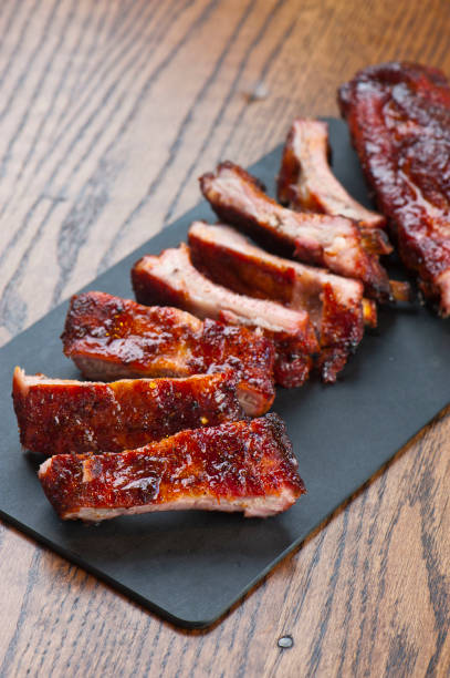 istock Barbecue. Picnic BBQ table spread. Beef brisket, chicken, pork ribs, beef ribs, Mac n cheese, cornbread, Brussels sprouts, coleslaw, and beer. Classic traditional Texas bbq meats and side dishes. 1223797894