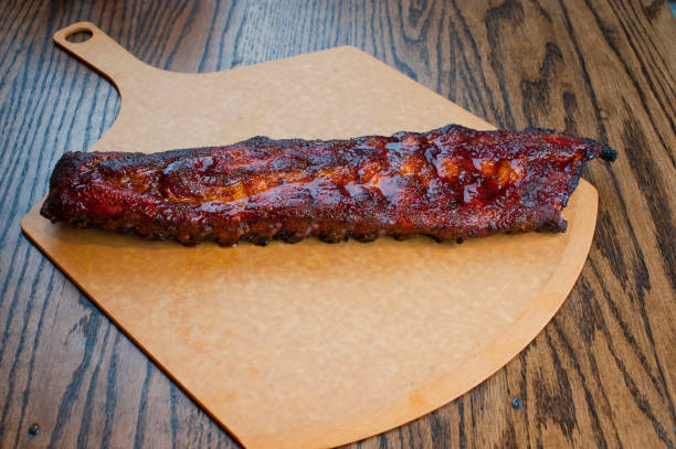 istock Barbecue. Picnic BBQ table spread. Beef brisket, chicken, pork ribs, beef ribs, Mac n cheese, cornbread, Brussels sprouts, coleslaw, and beer. Classic traditional Texas bbq meats and side dishes. 1223797941