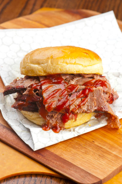 istock Barbecue. Picnic BBQ table spread. Beef brisket, chicken, pork ribs, beef ribs, Mac n cheese, cornbread, Brussels sprouts, coleslaw, and beer. Classic traditional Texas bbq meats and side dishes. 1223798845