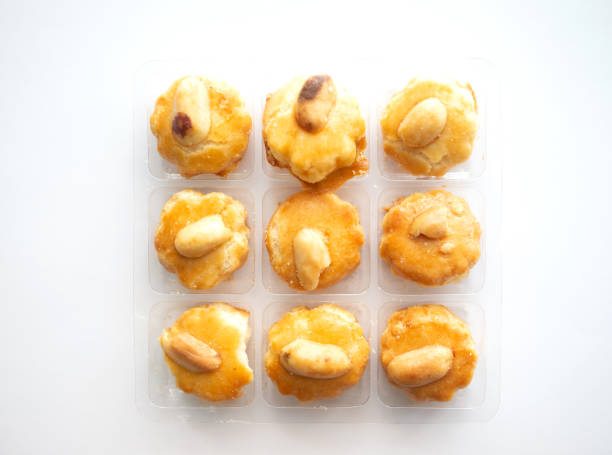 istock 3x3 small cookies in transparent plastic box on white background 1223800901