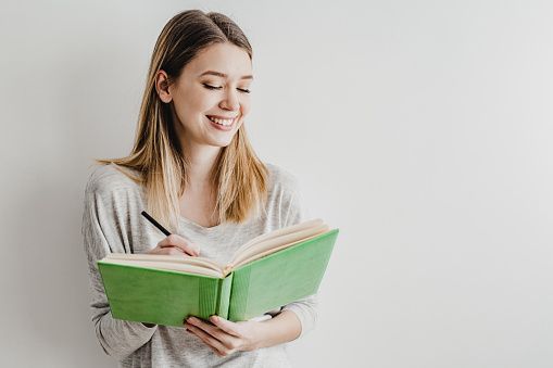 young beautiful woman with book, textbook