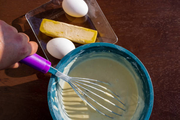 istock Person preparing dough for a pancake or Hotcakes 1223803170