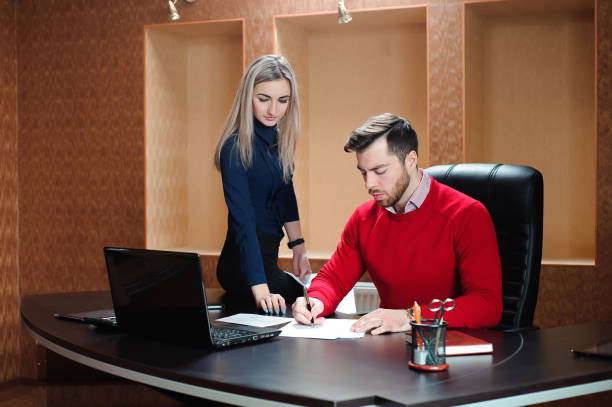 istock Business partner sitting at the table in front of a compute 1223809202