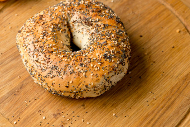 istock Breakfast or brunch buffet. Bagels, blueberry muffins, croissants, cinnamon rolls, scones, sunny side up eggs, bacon, butter, jelly, and cream cheese. Classic American or French breakfast. 1223809864