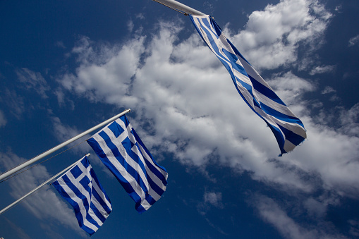 Greek Flags on Ornos Beach in Mykonos, Greece
