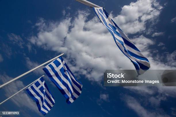 Greek Flags On Ornos Beach In Mykonos Greece Stock Photo - Download Image Now - Greek Flag, Aegean Islands, Beach