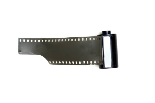 istock vintage photographic film with perforations in cassette on white background isolate 1223811210