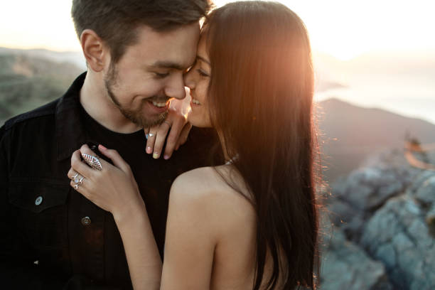 istock Bride and groom smile at each other close-up 1223814261