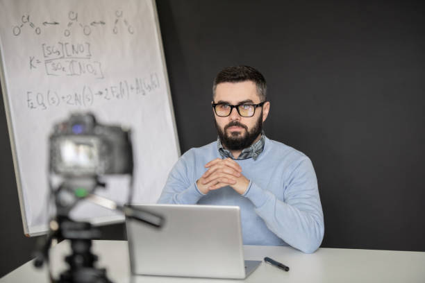 istock Serious bearded man holding hands by his face while looking at laptop display 1223814425
