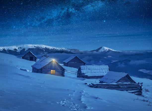 istock Carpathian mountain village illuminated by moon light 1223816968