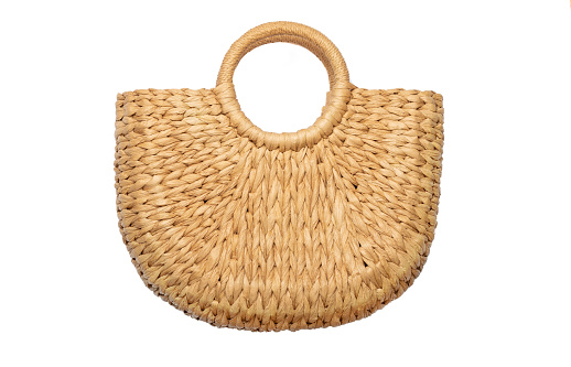 wicker straw basket bag isolated on white background. Beach summer or vintage autumn bag