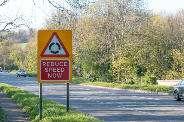 Road sign next to the A225 in Farningham in Kent, England. The sign shows the way to the M25 motorway as well as the M20 and the towns of Swanley and Dartford.