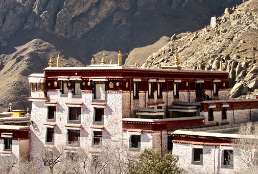 View of Gyantse Dzong, also known Gyangze Castle built on a huge spur of grey brown rock in Tibet, China