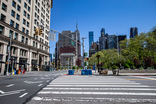 New York, New York - USA – May 7, 2020: Looking north from 23rd Street and Fifth Avenue are quiet due to health concerns to stop the spread of COVID-19  in New York City on Thursday, May 7, 2020.