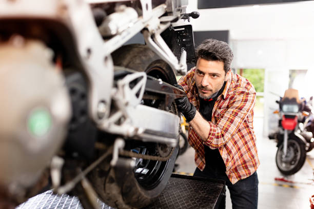 istock Motorbike Repairman 1223825609