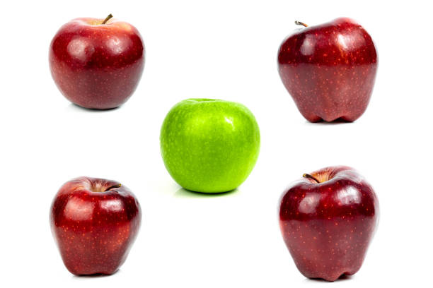 Red and green apples on white background