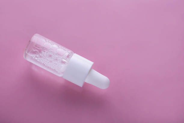 istock Liquid gel or serum on pink isolated background 1223826357