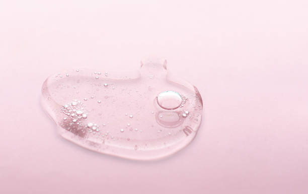 istock Liquid gel cosmetic smudge texture purple lilac background 1223826384