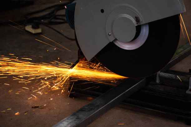 istock Steel cutter grinder are cutting iron pipe with bright sparks. 1223827274