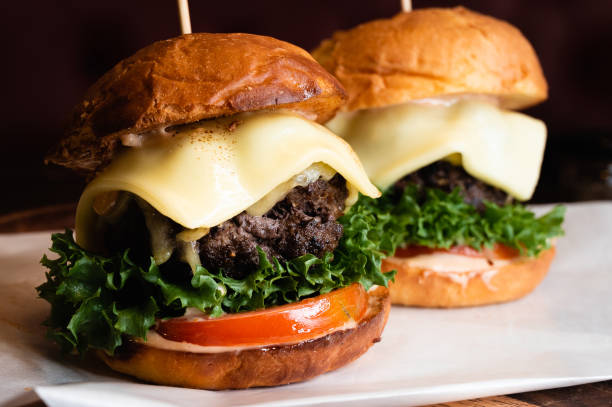 istock Two beef burgers with cheese 1223829202