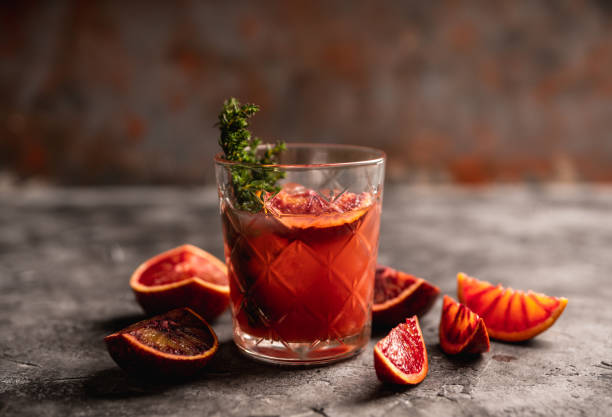 istock Old-fashioned cocktail with blood oranges and thyme on the rustic background 1223829469