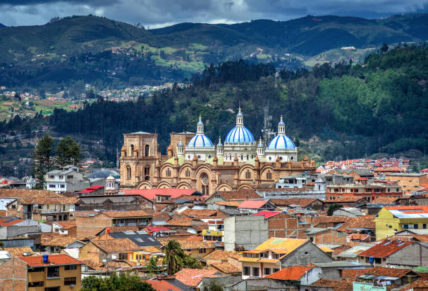 View of the Cathedral of Cuenca Cuenca's Cathedral La Inmaculada Concepcion, in middle of it's beautiful city, on a sunny and cloudy afternoon. Cuenca, Azuay Province, Ecuador. cuenca ecuador stock pictures, royalty-free photos & images