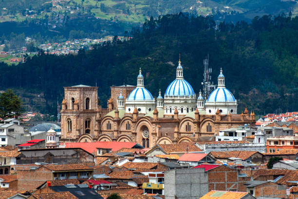 Cuenca's Cathedral La Inmaculada Concepcion, in middle of it's beautiful city, on a sunny and cloudy afternoon. Cuenca, Azuay Province, Ecuador.