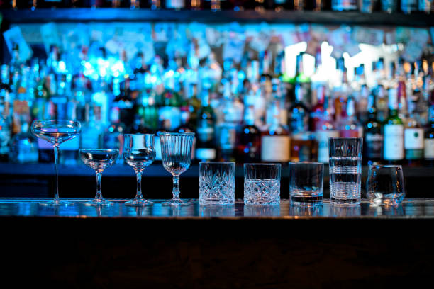 istock Several glasses of different forms stand on bar counter. 1223831204
