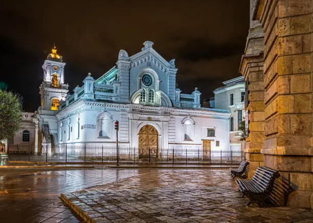 Cuenca, Ecuador, November 2013: The Sanctuary church facade and side views, at night time, after a rainy afternoon.