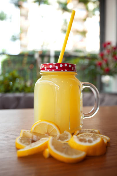 istock Cold lemonade on wooden table / lemonade with straw 1223833385