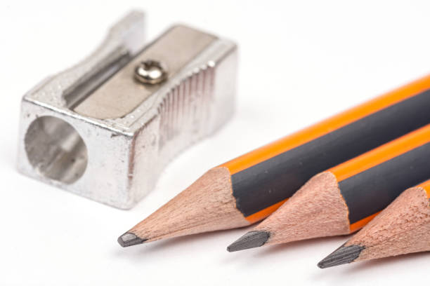 istock Wooden pencils with metal sharpener over white background 1223833684