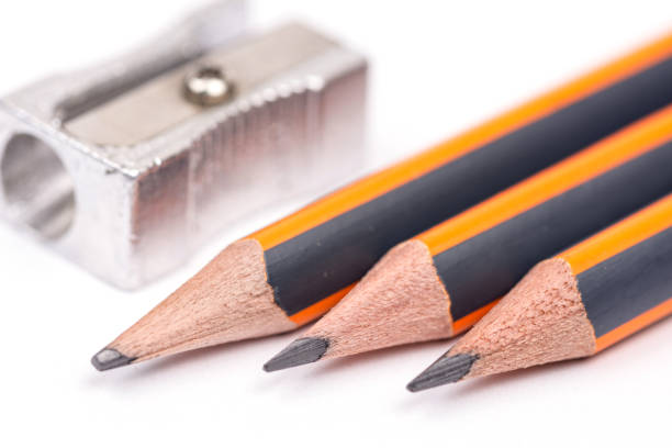 istock Wooden pencils with metal sharpener over white background 1223833686