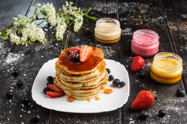 Fresh homemade pancakes with fresh fruits and honey