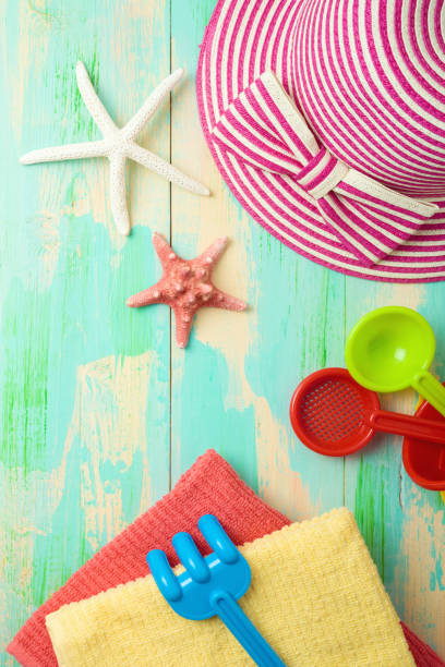 istock Summer background with beach items on wooden board. Top view from above 1223835673