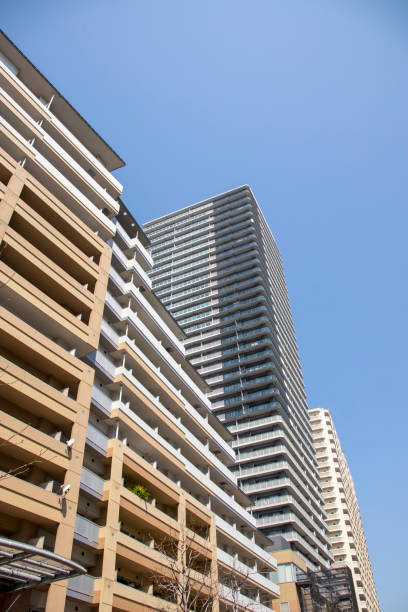 istock Japanese skyscrapers and blue sky looking up 1223835674