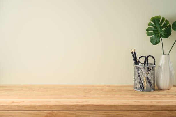 istock Wooden table with pencils and home decor plant 1223835683