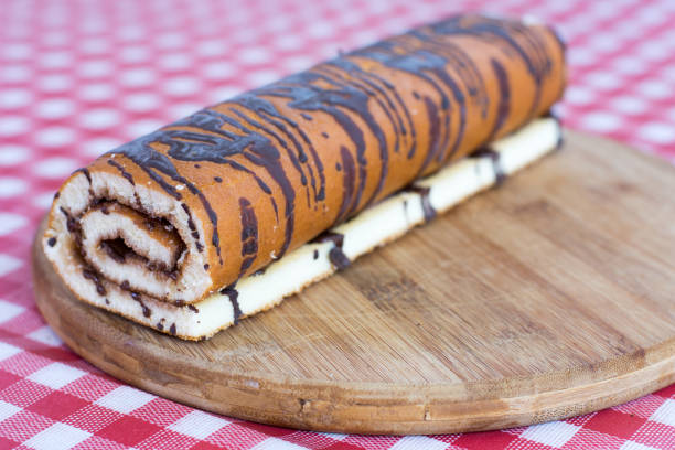 istock Chocolate roll cake on the wooden board 1223835888