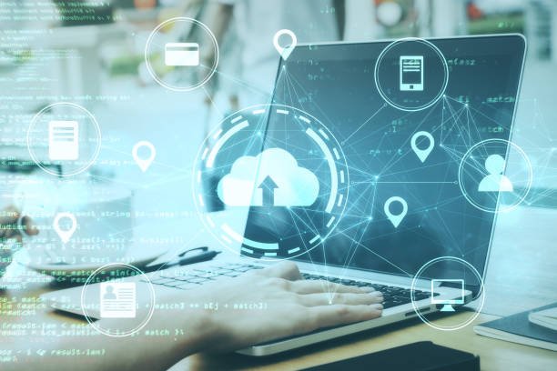 istock Woman hands using laptop with online shopping and networking cloud diagram. 1223836046