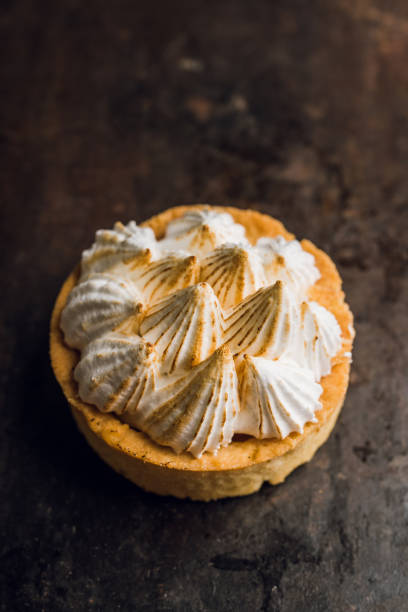 istock Creamy cake decorated with meringue cream on the rustic background 1223836882