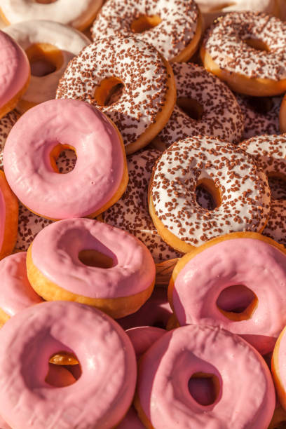 istock Pink strawberry and chocolate doughnuts donuts 1223838927