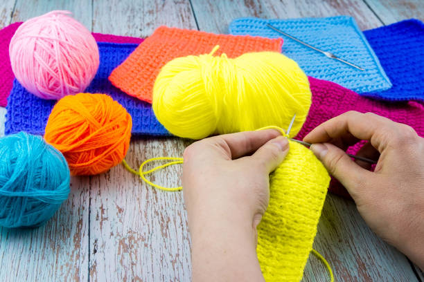 istock girl knits sock knitting needles. 1223839297
