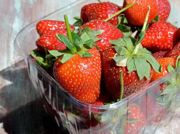 istock organic and fresh strawberries on a  wooden background 1223840132